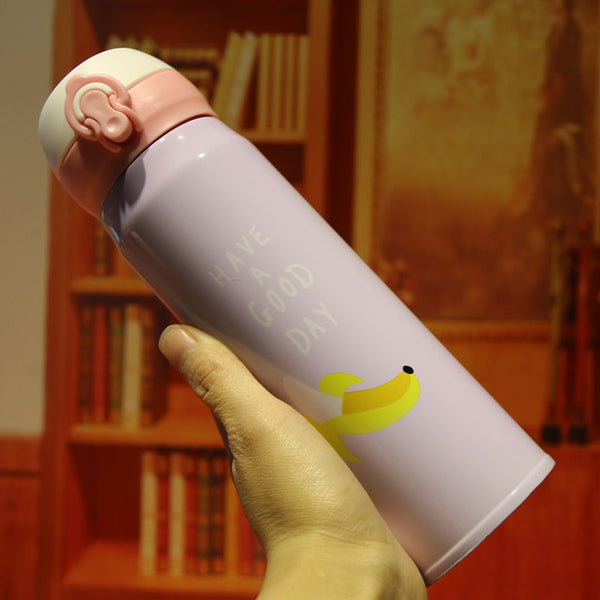 Thermos rose avec dessin d'une banane